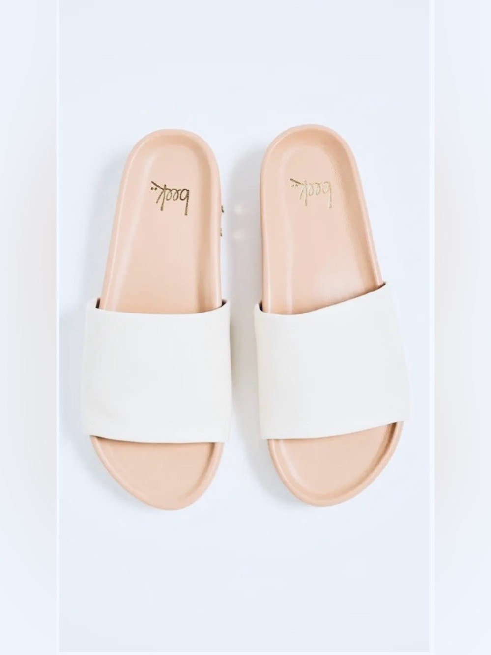 Beek Pelican sandals with a white leather upper strap and a tan molded footbed